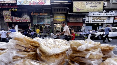 Piles of bread for sale in Midan, a district of Damascus renowned for its sweet delicacies. AFP