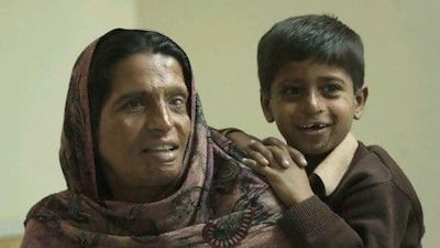 Mumtaz and her 7-year-old son, Mozam, live at the Acid Survivors Foundation in Islamabad. Adnan Khan
