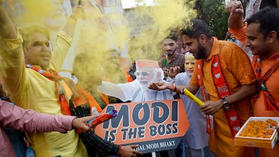 Bharatiya Janata Party supporters celebrate outside party headquarters in New Delhi as early election results suggest another term for BJP Prime Minister Narendra Modi. Reuters