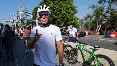 Lance Armstrong prepares to ride with Lebanese and foreign cyclists at the site of the August 4 deadly blast in the port of Beirut AP