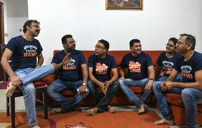 Manoj Munishwar talks politics with fellow Indian expatriates Prasad Deshpande, Dhiraj Gupta, Atul Sontakke, Shreyas Despande and Rajesh Naik in Abu Dhabi. Khushnum Bhandari for The National