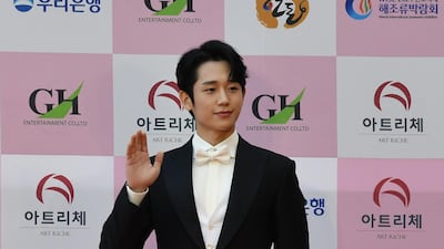 Actor Jung Hae-in poses for a photo on the red carpet of the 56th annual Daejong Film Awards. AFP