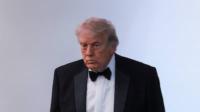 Mr Trump looking shaken after the shooting. Reuters