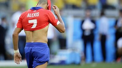 Alexis Sanchez of Chile reacts after missing a penalty during shootout against Brazil on Saturday at the 2014 World Cup in Belo Horizonte, Brazil. Dennis Sabangan / EPA