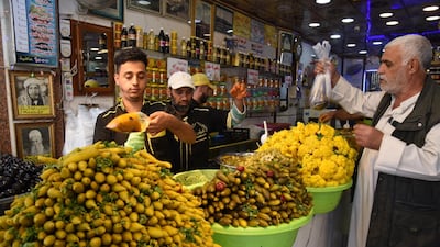 An Iraqi man buys pickles in Mosul, northern Iraq. EPA