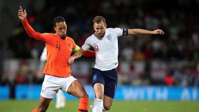 Netherlands' Virgil Van Dijk, left, duels for the ball with England's Harry Kane during the UEFA Nations League semi final between the Netherlands and England. AP Photo