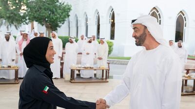 Sheikh Mohamed bin Zayed, Crown Prince of Abu Dhabi and Deputy Supreme Commander of the Armed Forces, greets one of the country's newly-qualified nuclear reactor operators during a Sea Palace barza. Hamad Al Kaabi / Crown Prince Court - Abu Dhabi