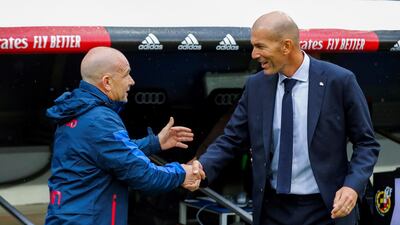 Real Madrid's head coach Zinedine Zidane, right, greets Levante's head coach Paco Lopez. EPA