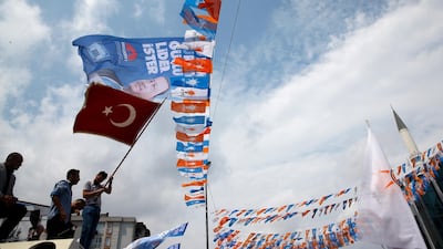 A man waves a Turkish flag during an election rally of Turkey's President Recep Tayyip Erdogan and his ruling Justice and Development Party, or AKP, in Istanbul, Turkey, on June 23, 2018. Lefteris Pitarakis / AP Photo