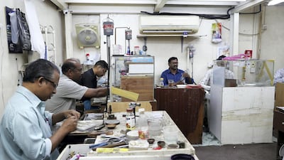 Workers make silver and gold jewellery at Al Baroon Gold Factory in Al Mareija in Sharjah. Pawan Singh / The National