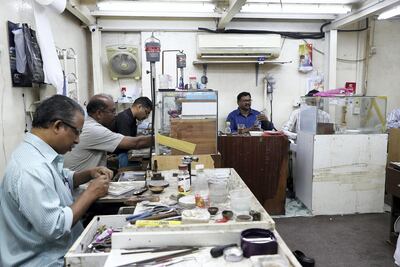 Workers make silver and gold jewellery at Al Baroon Gold Factory in Al Mareija in Sharjah. Pawan Singh / The National