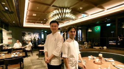 Dai Pai Dong’s head chef He Jia, left, and the Rosewood Abu Dhabi’s executive sous chef Siddharth Krishna. Ravindranath K / The National