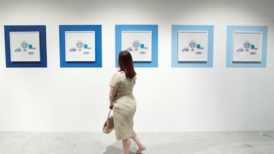 A spectator at the Gateway: Fragments, Yesterday and Today exhibition during the 11th edition of Abu Dhabi Art. The exhibition is still available to see at Manarat Al Saadiyat, Saadiyat Cultural District. Reem Mohammed / The National