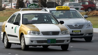 Abu Dhabi's gold-and-white taxis were gradually phased out and replaced with silver vehicles. Stephen Lock / The National