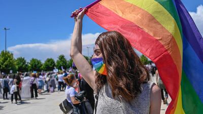 A rainbow flag is waved at a march in Istanbul to protest against Turkey's withdrawal from the Istanbul Convention safeguarding the rights of women. AFP