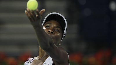 Venus Williams prepares to serve during her first round match against Elena Vesnina of Russia, which she won 6-3, 6-2. Kamran Jebreili / AP