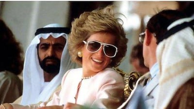 Diana, Princess of Wales and Prince Charles, Prince of Wales watch camel racing during a visit to Abu Dhabi, in March 1989. On left is Sheikh Nahayan and on right (with his back to camera) is Sheikh Tahnoun.