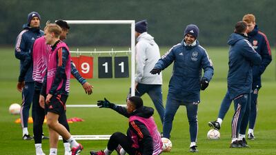 Arsenal manager Mikel Arteta, Gabriel Jesus and other team members during training. Reuters