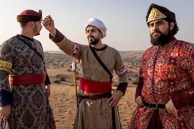 Mahmoud Qalyoubi, centre, prepares for the first event of the day, a trial of long-distance shooting in which arrows reach beyond 200 metres. Antonie Robertson / The National