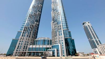 The JW Marriott Marquis in Dubai, which has been open since November but is preparing for its official launch later this week, tops the list of the world's tallest towers at 355 metres. Jeffrey E Biteng / The National