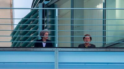 German Chancellor Angela Merkel (R) and British Prime Minister Theresa May speak on the terrasse at the Chancellery in Berlin on April 9, 2019. Embattled British Prime Minister Theresa May is visiting Berlin on April 9, 2019 for talks with German Chancellor Angela Merkel before travelling to Paris. / AFP / John MACDOUGALL