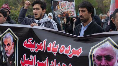 Pakistani Shiite Muslims protest over the U.S. airstrike in Iraq that killed Iranian Revolutionary Guard Gen. Qassem Soleimani, in Islamabad, Pakistan, Friday, Jan. 3, 2020. Iran has vowed "harsh retaliation" for the U.S. airstrike near Baghdad's airport that killed Tehran's top general and the architect of its interventions across the Middle East, as tensions soared in the wake of the targeted killing. Banner reads "Down with America, down with Israeil." (AP Photo/B.K. Bangash)