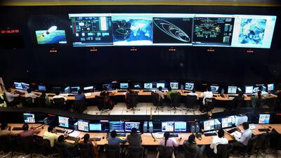 Indian scientists and engineers from Isro monitor the Mars Orbiter Mission at the agency's telemetry, tracking and command centre in Bangalore. AFP