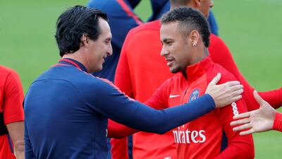 Unai Emery, the Paris Saint-Germain coach, left, has said that the arrivial of Neymar, right, from Barcelona, has increased expectation on them to shine in the Uefa Champions League. Charles Platiau / Reuters