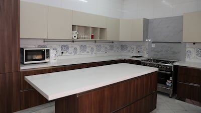 A kitchen with room to host a few friends