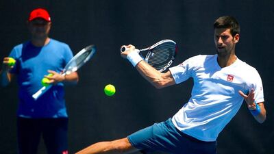 Novak Djokovic hits a forehand during a training session. David Gray / Reuters