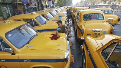 Sumitra Sarkar earns up to 150 rupees a day cleaning taxis in Kolkata. The UN secretary general Ban Ki-moon said in his International Women’s Day statement the international community has a common obligation to ensure women earn equal pay for equal work. Rupak De Chowdhuri / Reuters