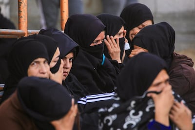 Displaced Palestinian women mourn loved ones killed in an overnight Israeli strike in Gaza. AFP