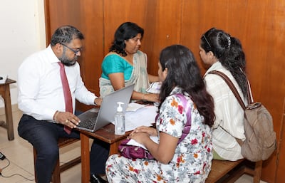 Sri Lankan consular officials give people information on visa rules. The National