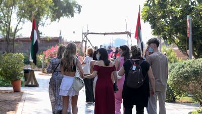 Tourists at the Heritage Village at Abu Dhabi's Corniche. Government initiatives have help the sector rebound from the pandemic. Khushnum Bhandari / The National