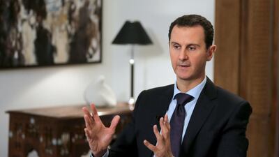 Syrian president Bashar Al Assad gestures during an exclusive interview with Agence France-Presse in the capital Damascus on February 11, 2016. Joseph Eid/AFP