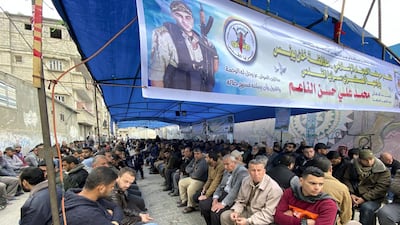 Men attend the funeral of Mohammed Al-Na'em