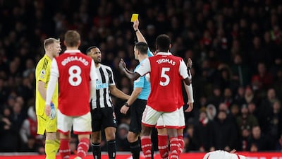 Referee Andy Madley shows a yellow card to Callum Wilson Newcastle in the first half. Getty
