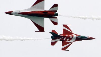 Singapore Air Force’s Black Knights perform a manoeuvre during an aerial display at the Singapore Airshow. Edgar Su / Reuters