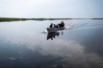 Fishermen in the Hawizeh Marshes in southern Iraq, after rainfall following a long drought. AFP