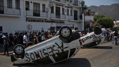 A street is blocked during a protest against the kidnapping and murder of eight-year-old Camila Gomez in Taxco de Alarcon, Mexico. The alleged perpetrators were lynched by members of the community. EPA