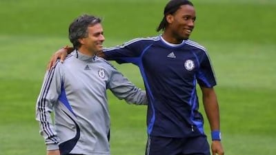 Coach Jose Mourinho, left, and Didier Drogba spent three memorable years together at Chelsea but will be on opposite sides tonight. Stu Forster / Getty Images