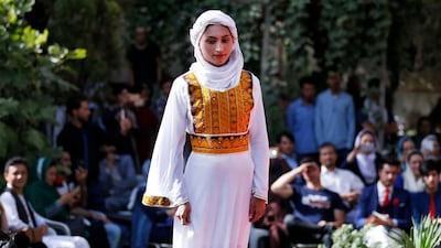 An Afghan model presents traditional clothes during a modelling show organised by Haqiqa Modeling, in Kabul, Afghanistan, 10 August 2017. EPA