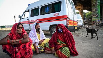 Women mourn a relative at a mass crematorium site on the banks of the Ganges on May 5, 2021 in the northern Indian city of Allahabad. The country set a new grim record of 4.12 lakh infections on Thursday. Getty Images