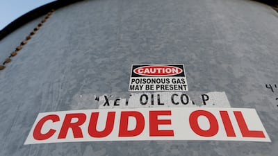A sticker reads crude oil on the side of a storage tank in the Permian Basin in Mentone, Loving County, Texas. Oil prices have gained about 50 per cent since the start of the year as countries press on with vaccination programmes and major economies reopen. REUTERS