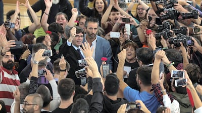 Catalan president Carles Puigdemont gestures while visiting the polling station where he was expected to vote, in Sant Julia de Ramis on October 1, 2017. Albert Gea / Reuters