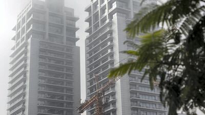Fog engulfs the tall buildings around the Barsha Heights area. Antonie Robertson / The National