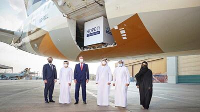 Representatives of the Hope Consortium are pictured with a shipment of vaccines being loaded onto an Etihad flight. The group will host a vaccine summit in March to look at the challenges of the global Covid-19 vaccine roll-out. Courtesy: Etihad Airways / Hope Consortium