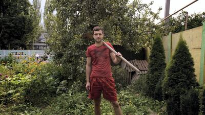Alexi, Donetsk, 2014: "This was my grandmother’s house, but it is mine now. I used to play here in the green buggy when I was three, but now am preparing the house for when I get married. I’m an engineer in a local factory, but it is closed now so I’m working in the house and on the garden. I hear the shelling coming closer; last night I slept in a corner, but I’m preparing the shelter for tonight with blankets and food. I don’t want war and don’t care how this started, but Ukrainian fighting Ukrainian is madness. I don’t want to live in a country where we are killing each other, but this is my home and these are my memories, so where else am i expected to go?" Photo: Lalage Snow
