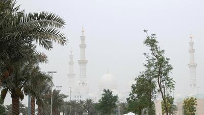 Sheikh Zayed Grand Mosque under hazy skies. Victor Besa / The National