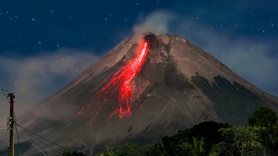 A long-exposure photo shows Mount Merapi in Indonesia spewing lava onto its slopes during an eruption. AFP